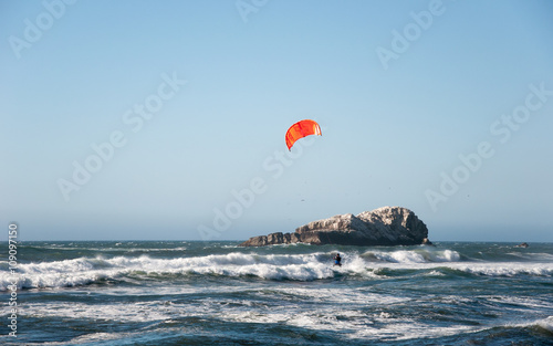 Matanzas, Chile - January 16, 2016 : Unidentified kitesurfer riding on the waves in Pacific ocean, documentary editorial.