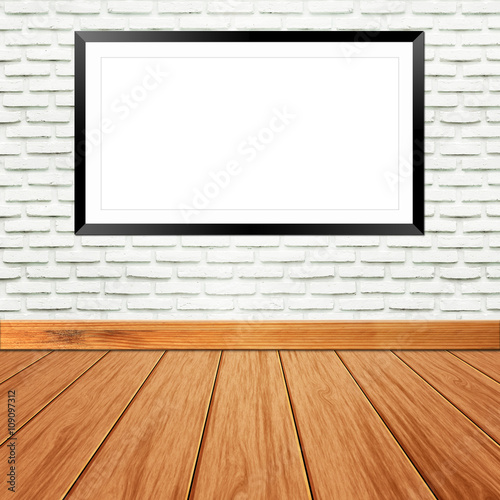 Blank billboard frame on brick wall