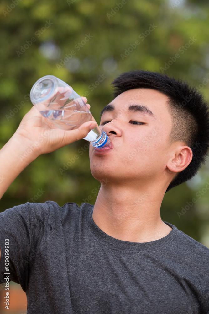 Teen boy with water stock image. Image of book, person - 73687417