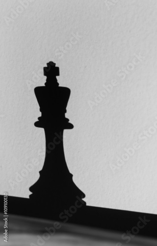 King Chess Piece and Shadow on Wall