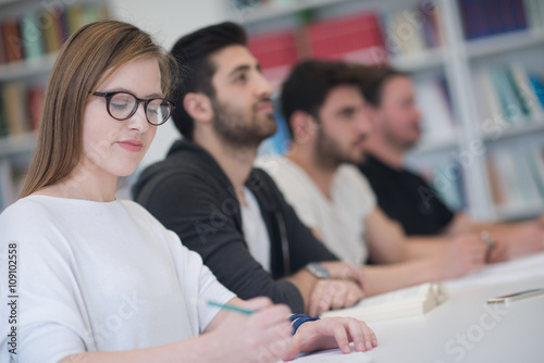 group of students study together in classroom