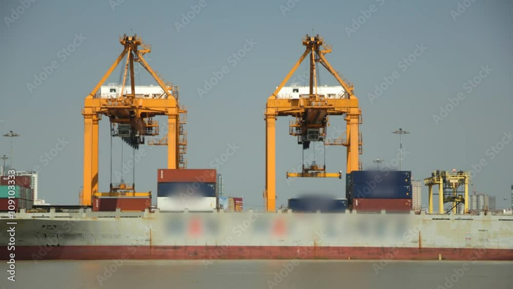 Cargo ship loading goods container at shipping port Cargo ship loading goods container at shipping port