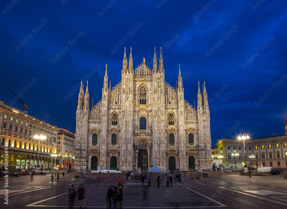  Cathedral in Milan (Duomo di Milano) on a sunset. Milan - second-large city of Italy - has reputation of financial and economic capital of country and one of world capitals of fashion.