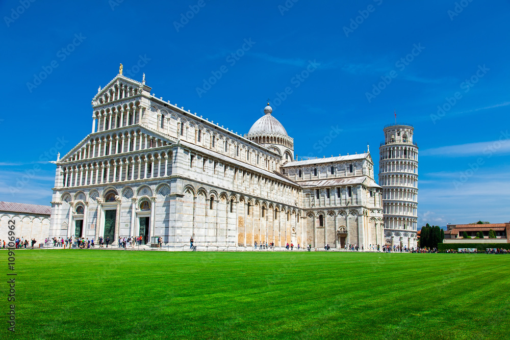 Tourists on Square of Miracles visiting Leaning Tower in Pisa, Italy. Leaning Tower of Pisa is campanile and is one of the most famous buildings in the world