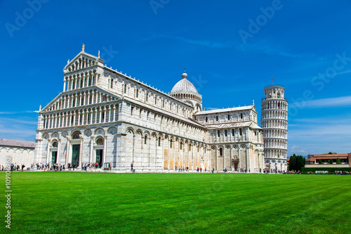 Tourists on Square of Miracles visiting Leaning Tower in Pisa, Italy. Leaning Tower of Pisa is campanile and is one of the most famous buildings in the world