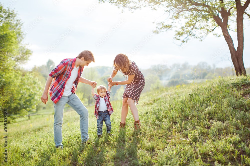 Happy Family Playing on the Nature