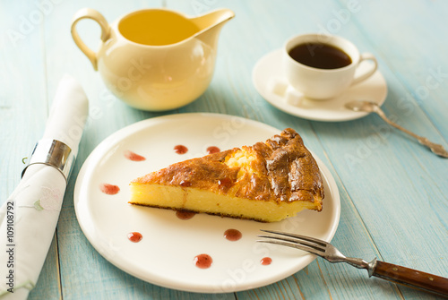 A piece of cottage cheese cake on a white plate photo