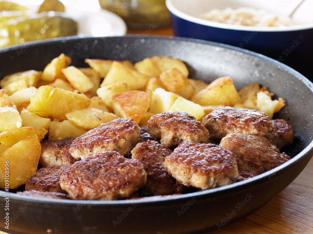 Fried potatoes and meatballs to the pan Fried potatoes and meatballs to the pan