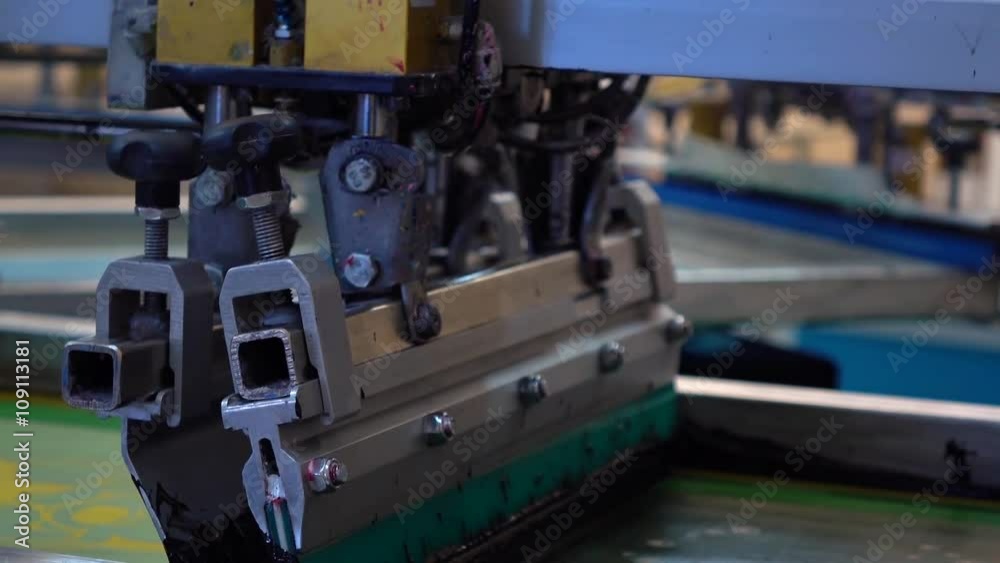 Industrial silk screen printing machine in action Industrial silk screen printing machine in action