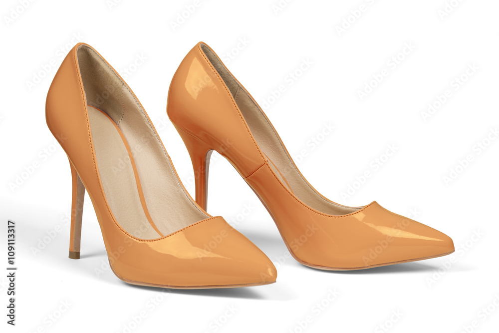 A pair of yellow high heel shoes isolated on white with clipping path. A pair of yellow high heel shoes isolated on white with clipping path.