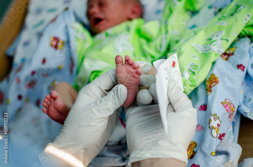 doctor takes a blood test in newborns