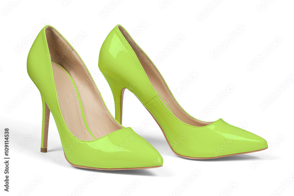 Naklejka premium A pair of green high heel shoes isolated on white with clipping path.