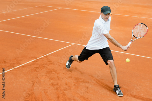 Tennis player in action © Microgen