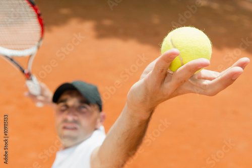 Tennis serve. Ball in focus © Microgen