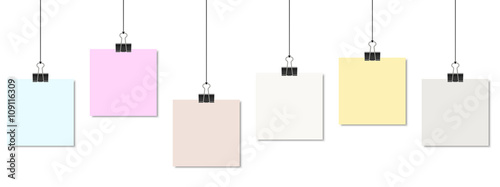 colored papers with binder clips