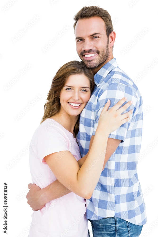 Portrait of happy young couple cuddling each other on white background Portrait of happy young couple cuddling each other on white background
