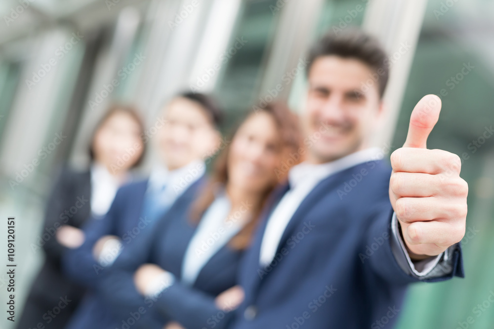 happy businessman smiles thumb up happy businessman smiles thumb up
