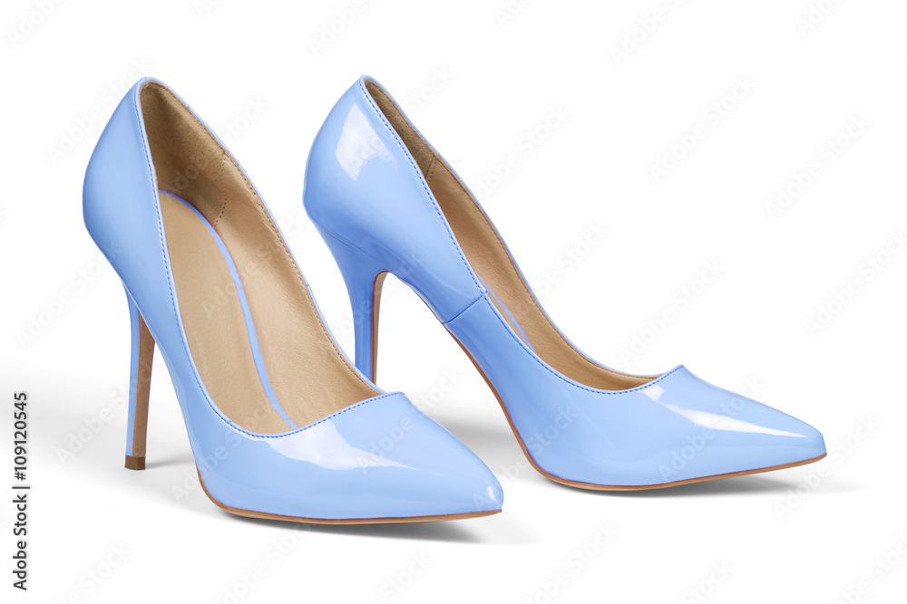 A pair of light blue high heel shoes isolated on white with clipping path. A pair of light blue high heel shoes isolated on white with clipping path.