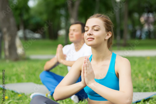 Having yoga practice in park