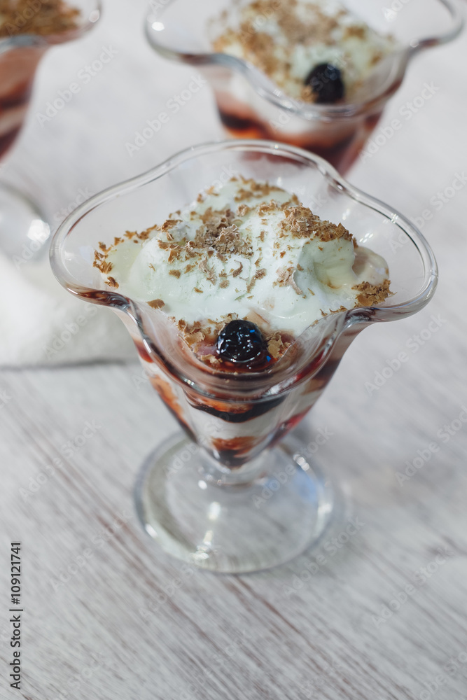 Delicious vanilla parfait with cherry jam and chocolate