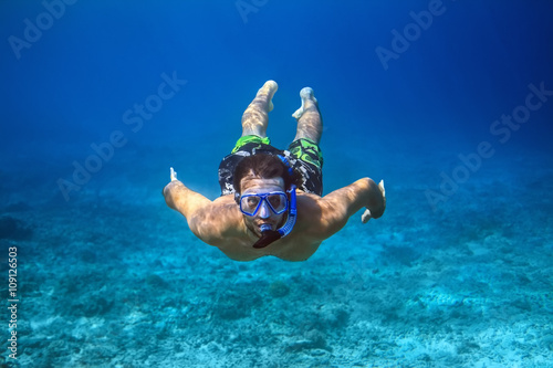 Underwater shoot of a young man snorkeling in a tropical sea