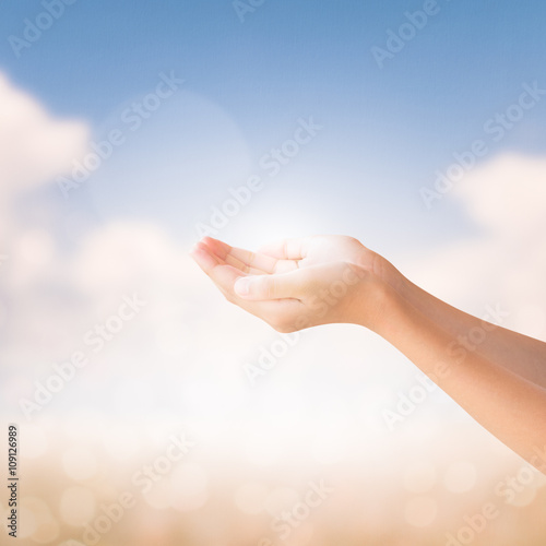 Hands of little girl on natural background