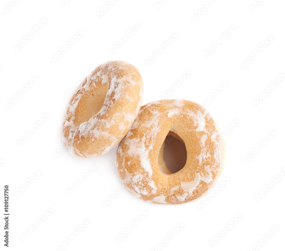 Stack of small cakes with hole isolated over the white background