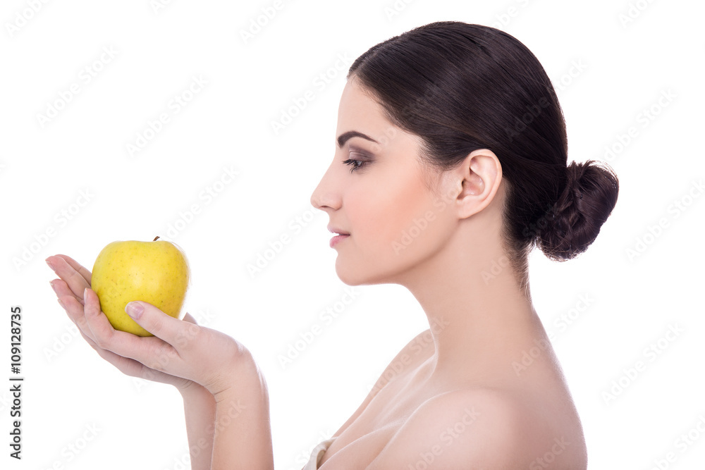 diet concept - side view of young beautiful woman with apple iso diet concept - side view of young beautiful woman with apple iso