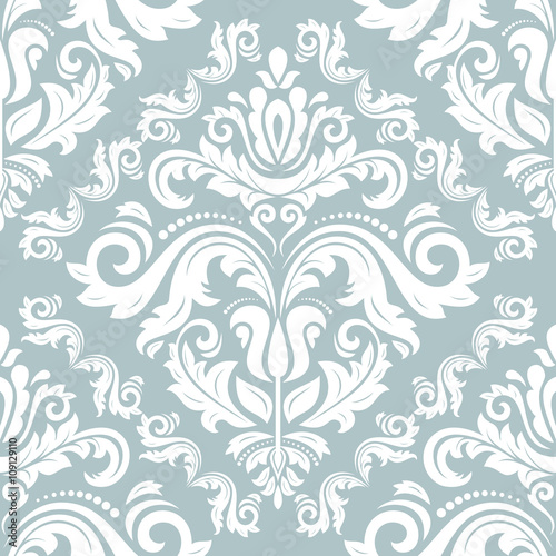 Seamless oriental ornament in the style of baroque. Traditional light blue and white classic vector pattern