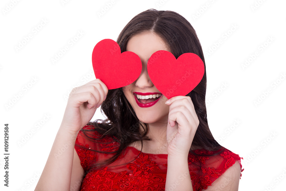 portrait of cheerful woman in red dress covering eyes with two p
