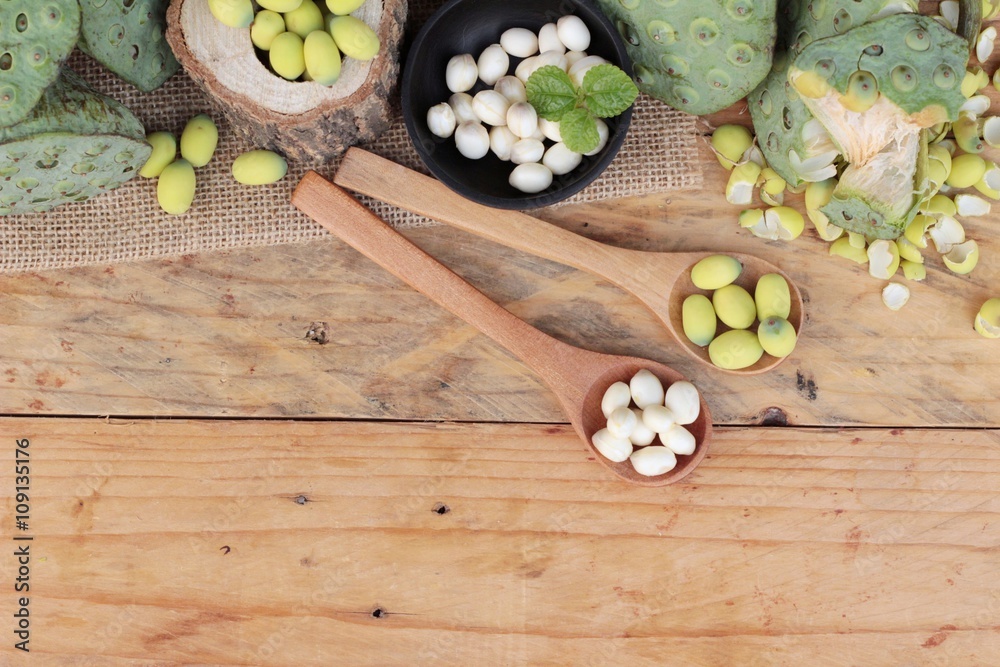 Lotus seeds in nature on wood background. Lotus seeds in nature on wood background.