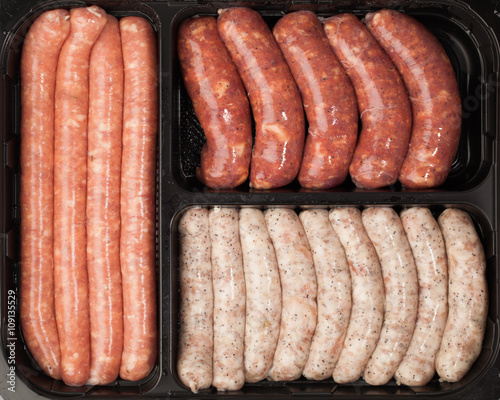 raw meat sausages in the container