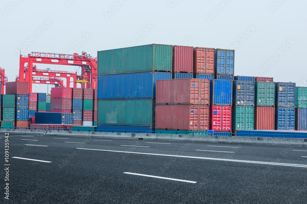 Fototapeta premium cargo containers and cranes at port