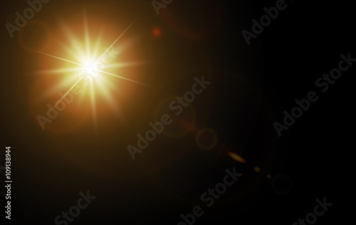 star on black background with flare