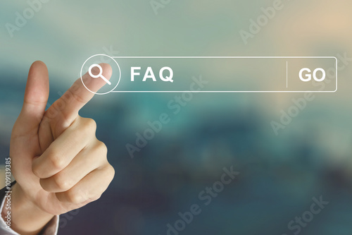business hand clicking FAQ or Frequently asked questions button photo