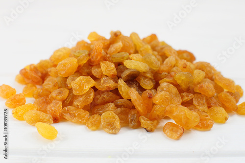 Yellow sultanas raisins isolated on white background cutout photo