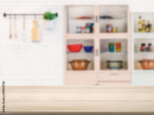 wooden counter top with kitchen cabinet background © phonlamaiphoto