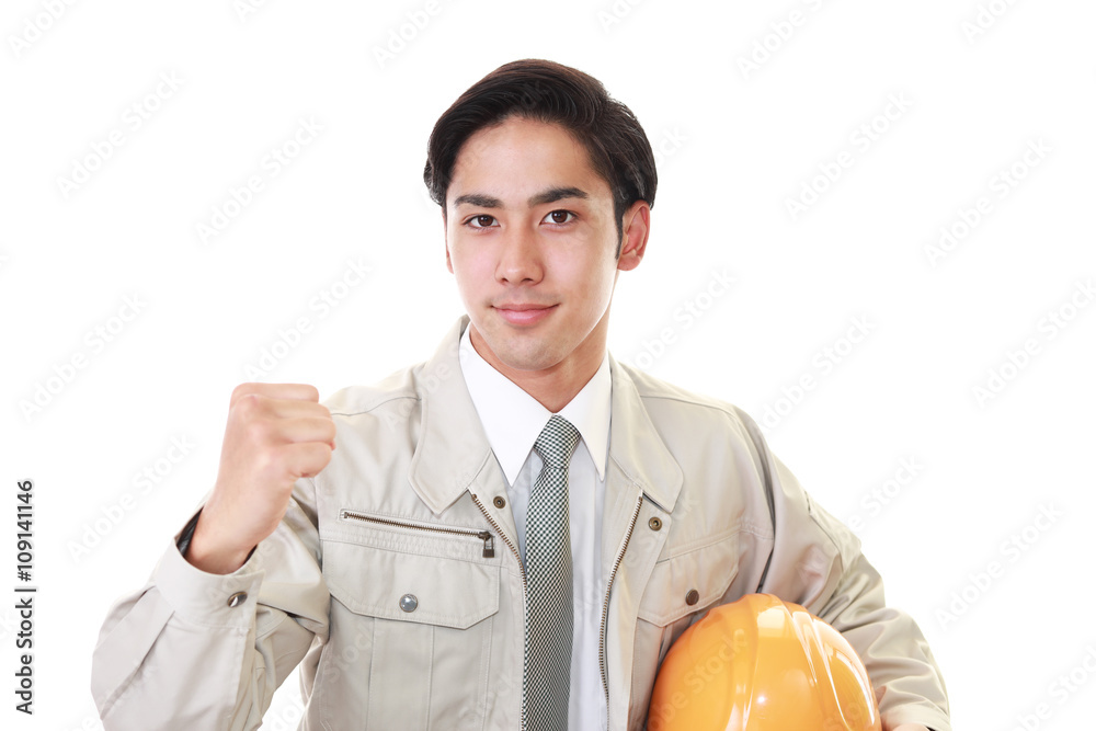 ガッツポーズの労働者