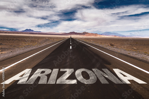 Arizona written on desert road