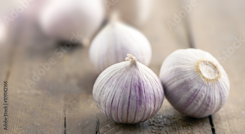 garlic bulbs on a wooden surface