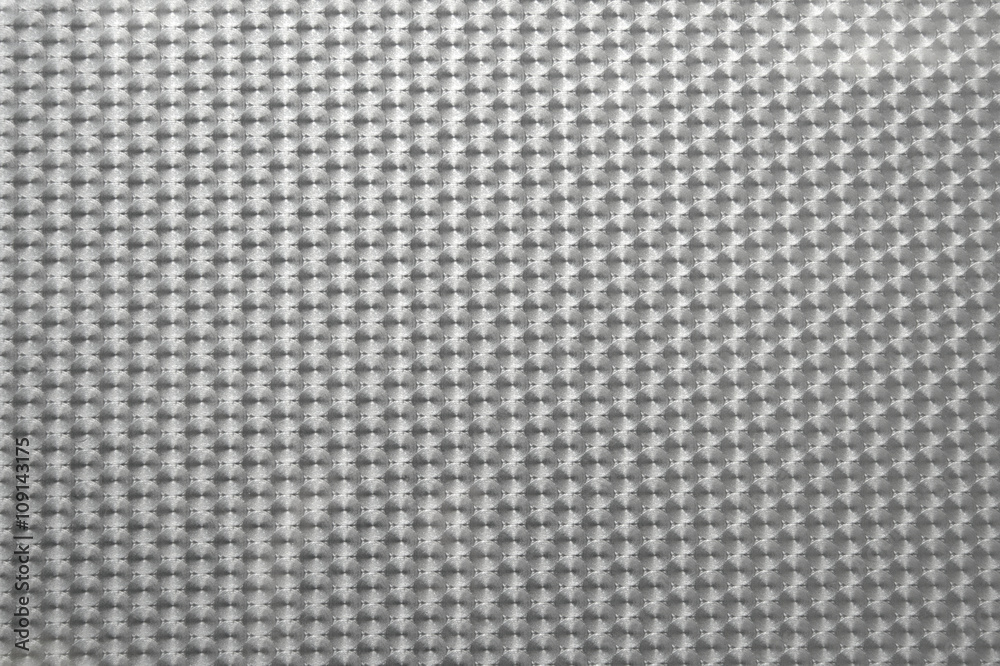 Self-adhesive semi-transparent window film showing a regular pearl pattern to reduce transparency, texture