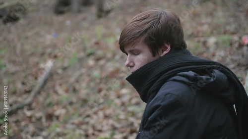 Lonely teenage emo guy having sad thoughts, depressive emotions after breakup