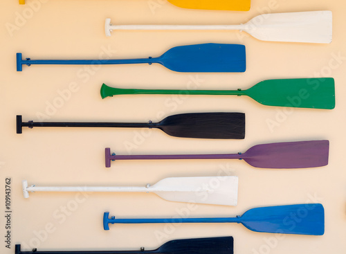 paddles colorful on the wall