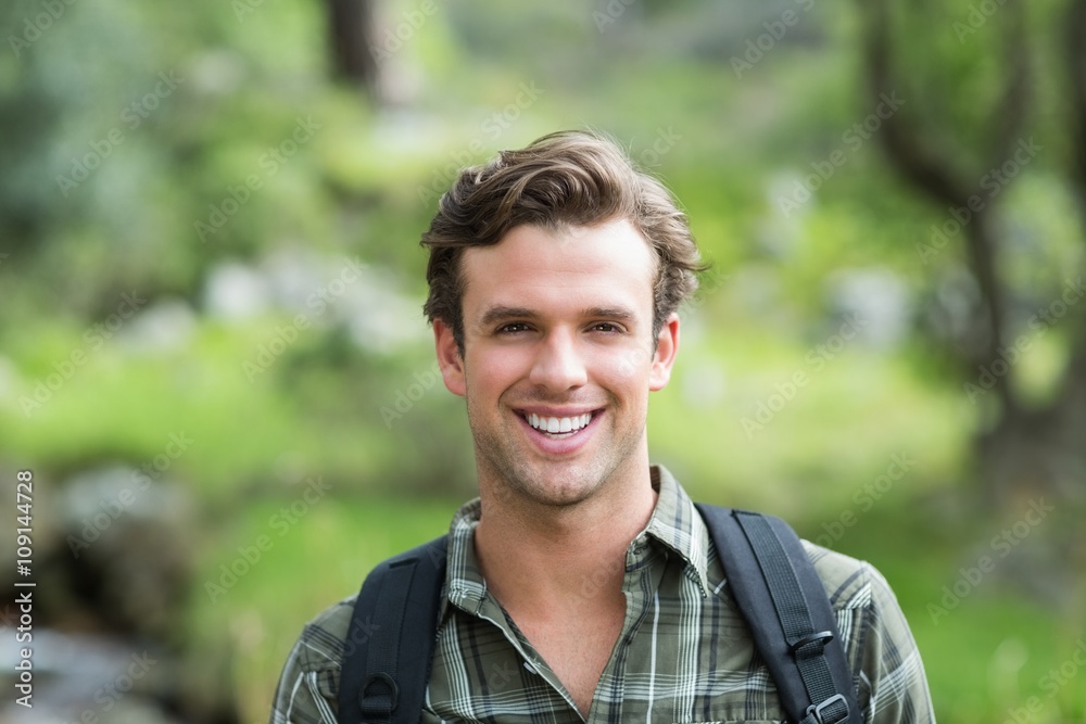 Handsome man smiling at the camera Handsome man smiling at the camera
