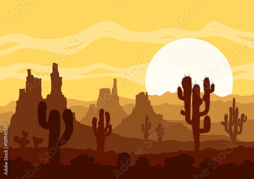 Sunset in stone desert  with cactuses and mountains.