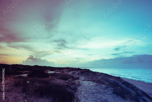 Filtered vintage view of seaside at dusk in Sardinia