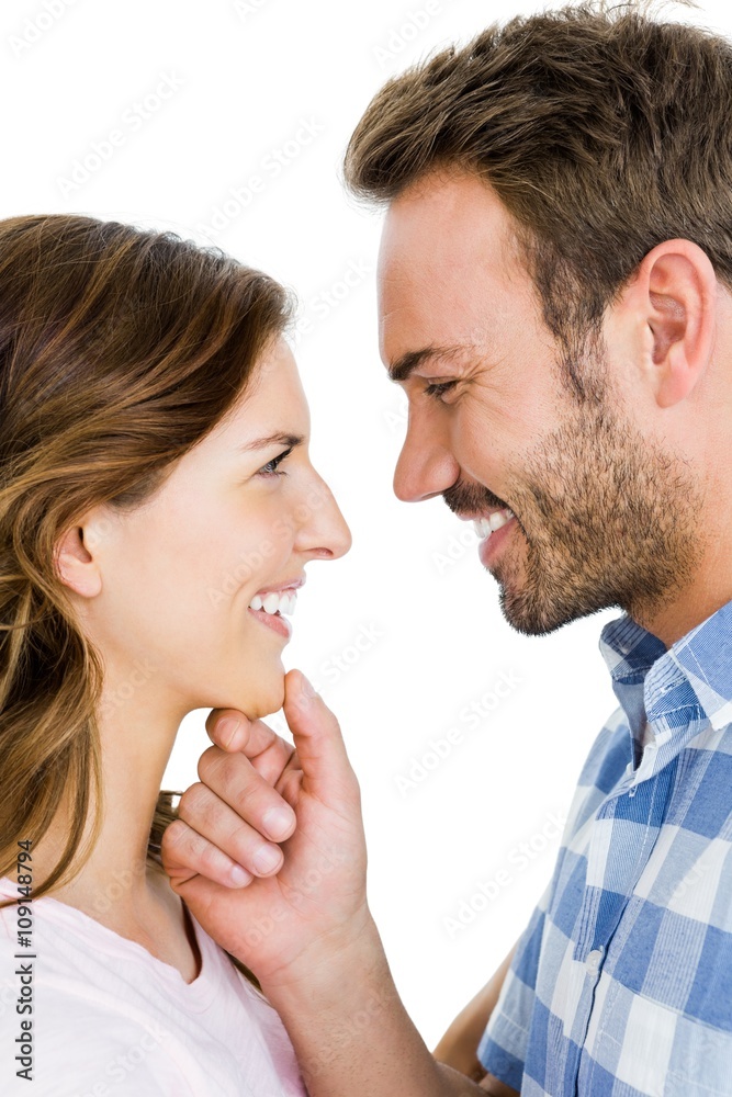 Happy young couple looking at each other and smiling Happy young couple looking at each other and smiling