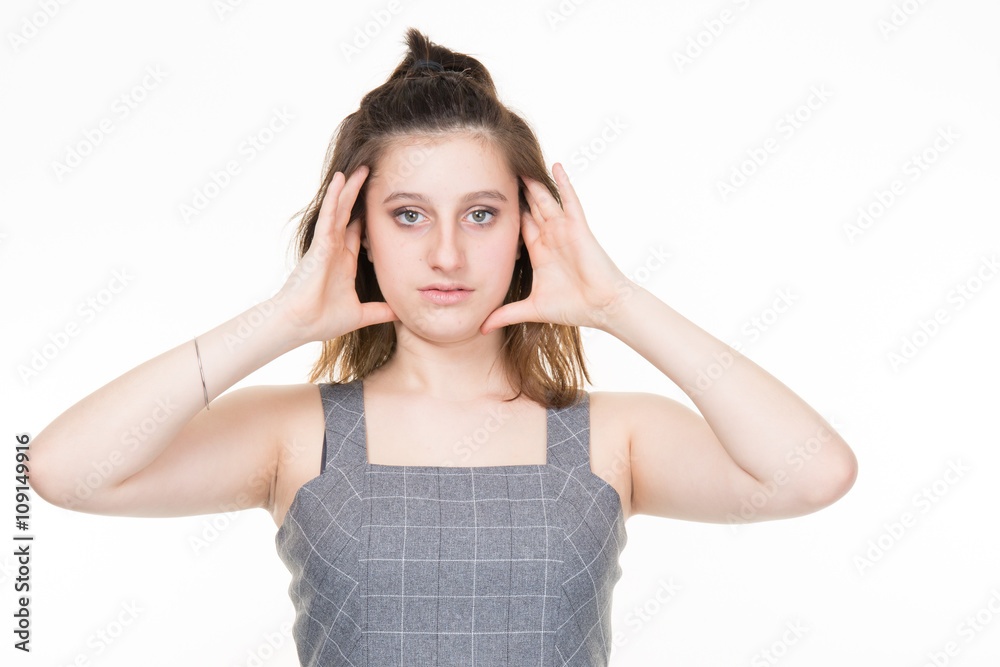 Teen girl holding head isolated on white background Teen girl holding head isolated on white background