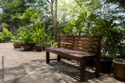 Wooden chairs in the garden on sunny days.