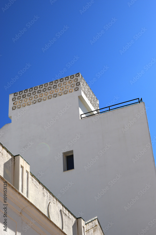 white facade of the building on a blue sky background  